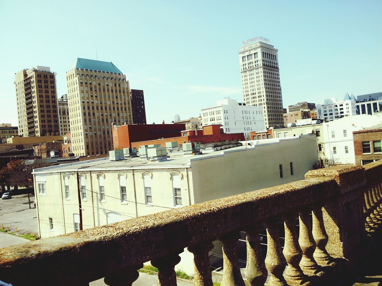 building exterior, architecture, built structure, clear sky, city, building, residential building, skyscraper, cityscape, day, office building, residential structure, sunlight, outdoors, tower, tall - high, sky, no people, copy space, modern