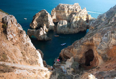 High angle view of rock formations in sea