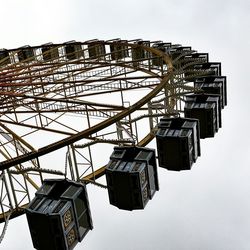 Low angle view of ferris wheel against sky