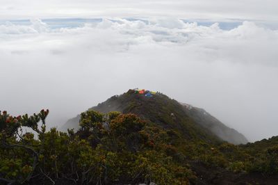 Scenic view of volcanic mountain against sky