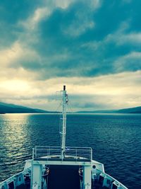 Ship sailing in sea against sky