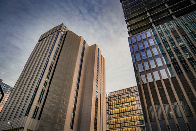 Low angle view of modern buildings against sky