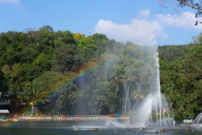 Scenic view of rainbow over fountain