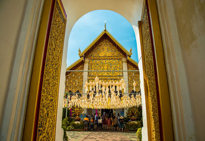 Group of people in temple outside building