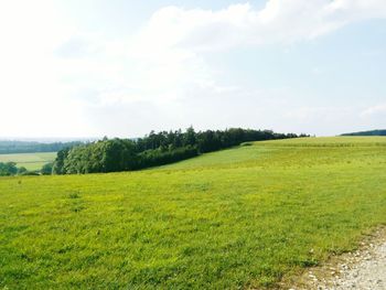 Scenic view of landscape against cloudy sky