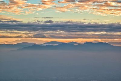 Scenic view of mountains against sky during sunset