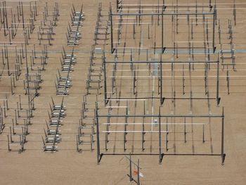 High angle view of electricity pylons on field