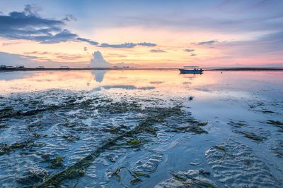 Scenic view of sea against sky during sunset