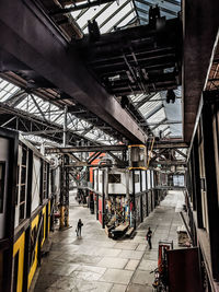 People walking on railroad station platform