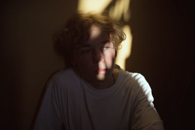 Thoughtful man sitting by window