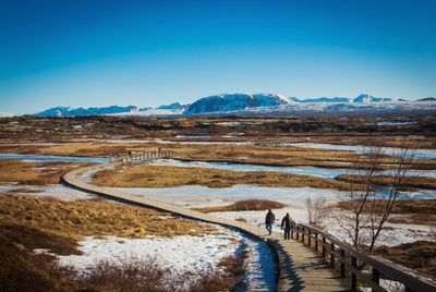 Scenic view of mountains against clear blue sky