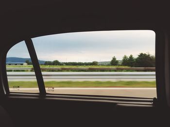 Road seen through car window