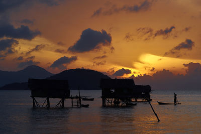 Scenic view of sea against orange sky