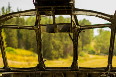 Close-up of old window against sky