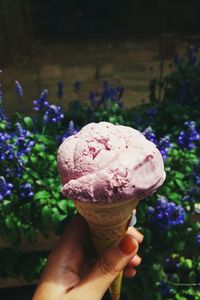 Close-up of hand holding ice cream cone