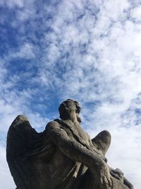 Low angle view of statue against sky