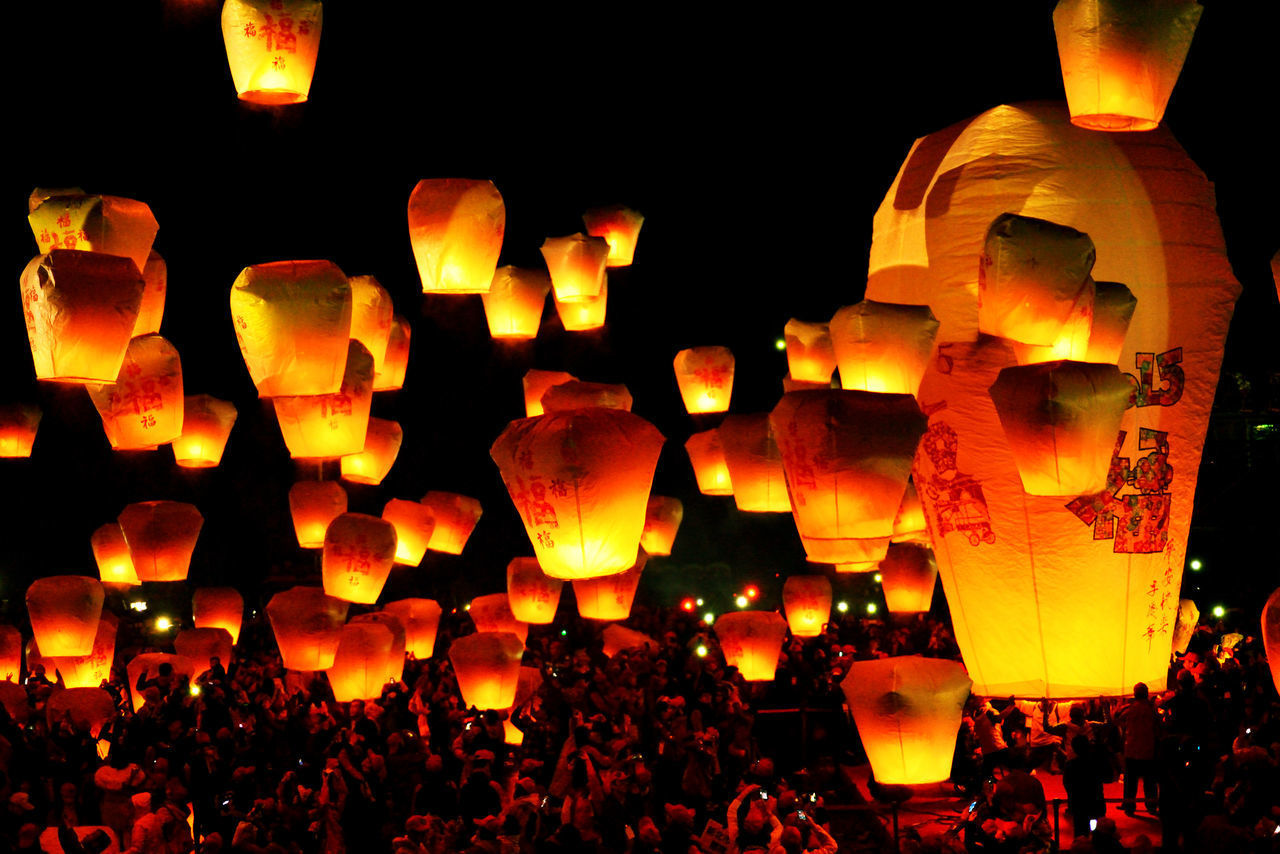 ILLUMINATED LANTERNS HANGING ON THE WALL