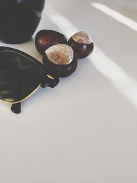 Cropped image of holding umbrella