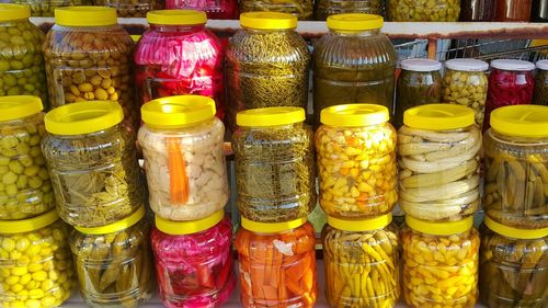 Various pickles in jars at market