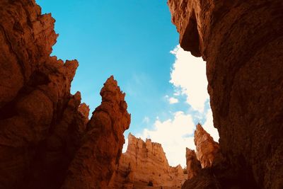 Low angle view of rock formations against sky