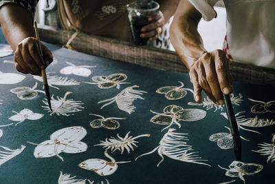 High angle view of man working on table