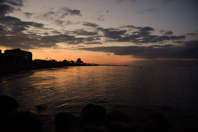 Scenic view of sea against sky at sunset