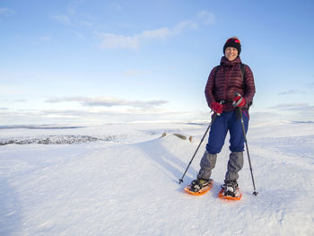 Full length of man on snowy mountain against sky
