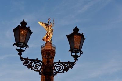 Low angle view of statue against sky