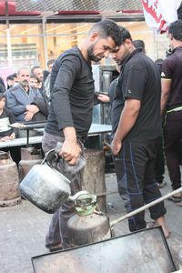 Men standing at market stall