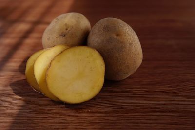 High angle view of potatoes on wooden table