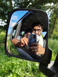 Man using mobile phone in car