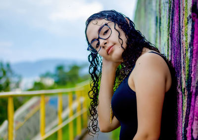 Beautiful young woman looking at camera