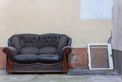 Empty chair in abandoned building