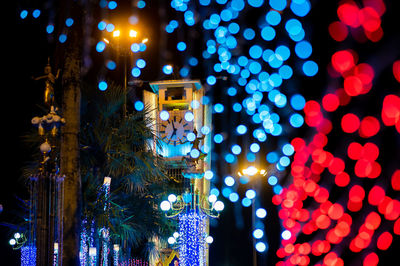Defocused image of illuminated christmas tree at night