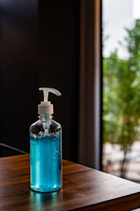 Close-up of glass bottle on table