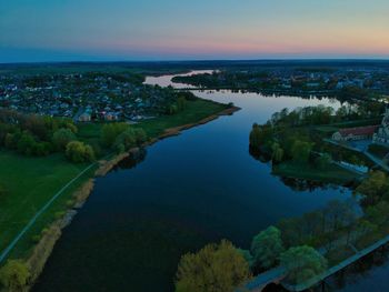 Scenic view of landscape and lake against sky