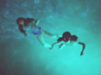 People swimming in water