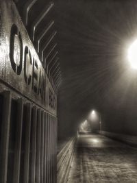 Illuminated tunnel at night