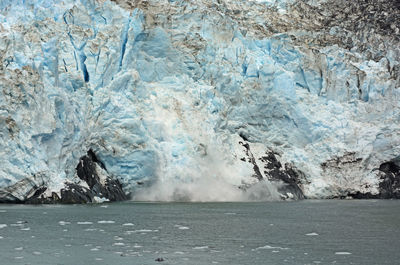 Scenic view of frozen sea against mountain