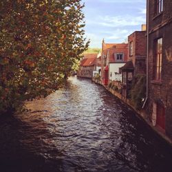 River with buildings against sky