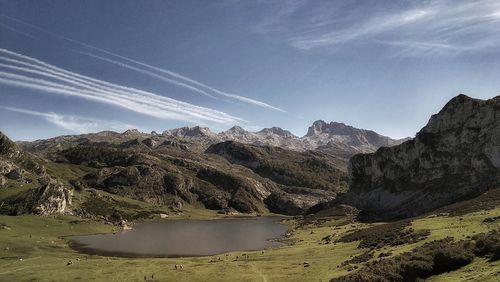 Scenic view of lake and mountains against sky