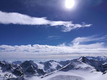 Scenic view of snow covered landscape against sky