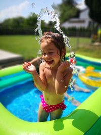 Girl playing in wading pool