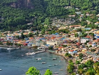 High angle view of townscape by sea