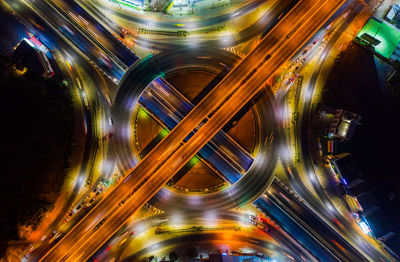 Light trails on highway in city at night