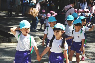 Children standing in stadium