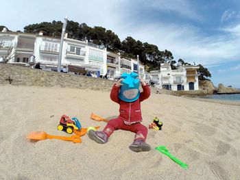 Children playing on sand at playground