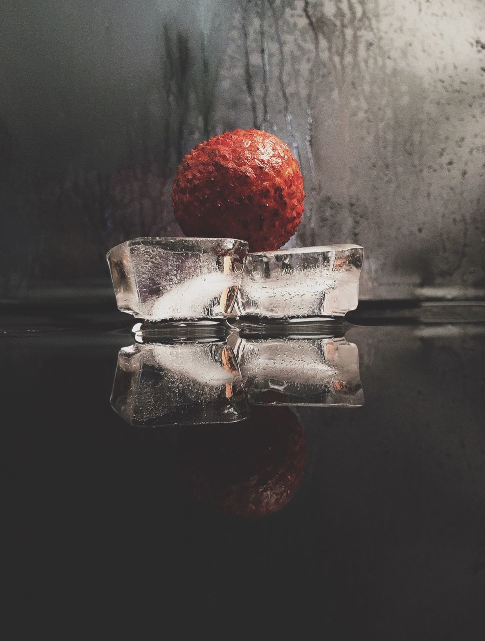 still life, red, close-up, indoors, high angle view, water, single object, table, no people, wet, wall - building feature, freshness, food and drink, damaged, wood - material, day, glass - material, metal, drop, two objects