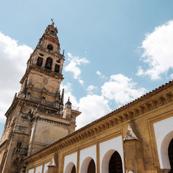 Low angle view of cathedral against cloudy sky