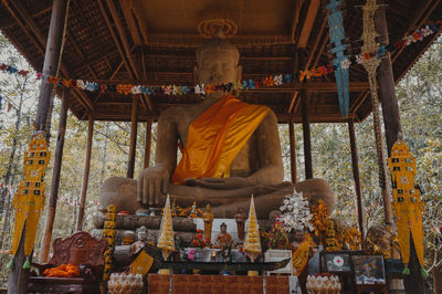 Rear view of statue against temple building